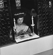 Woman kneeling down praying.